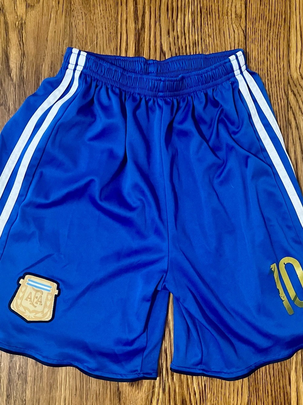 Messi Argentina YL Blue Soccer Shorts with White Stripes and Gold Detail
